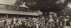 Community photograph outside the Church House 1909 - waiting for the Prince and Princess of Wales who were en route to the Huccaby Races